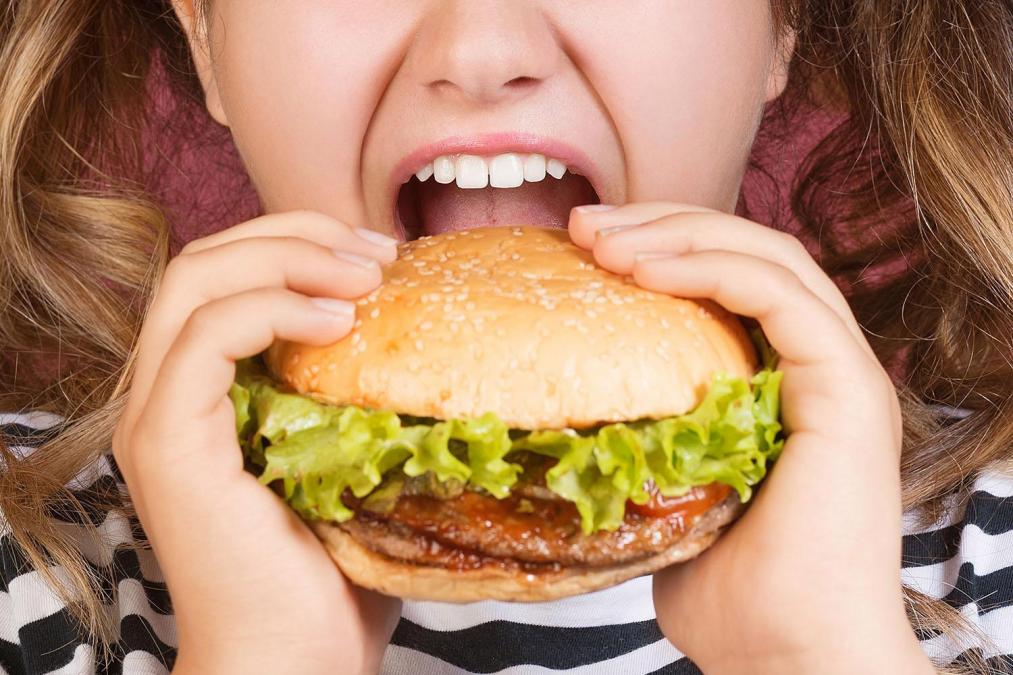 eating a cheeseburger